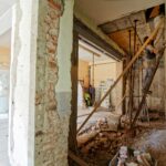 man climbing on ladder inside room